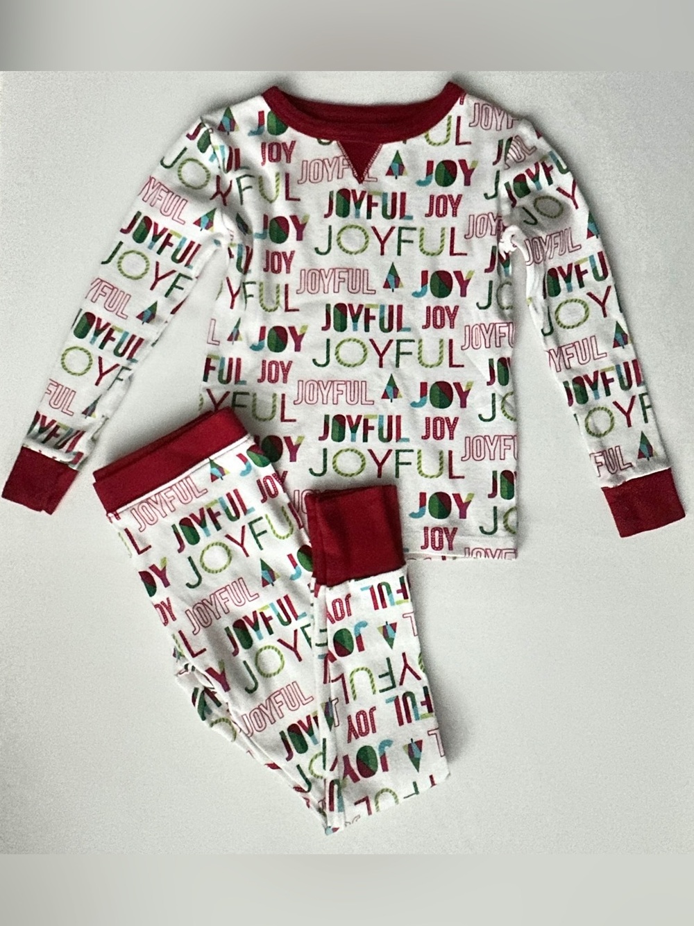 Wondershop kids pajama set a "JOYFUL" holiday print with red cuffs.  Size 4T.